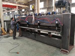 Workers are assembling needle punching machine